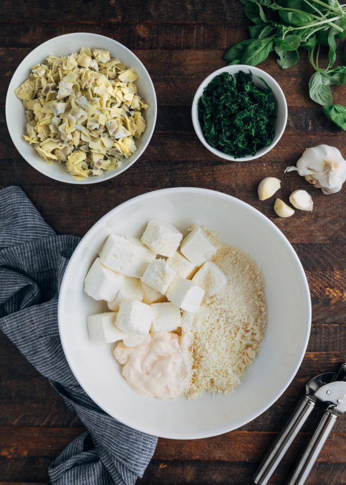 ingredients for 6 cheese spinach artichoke dip in bowls