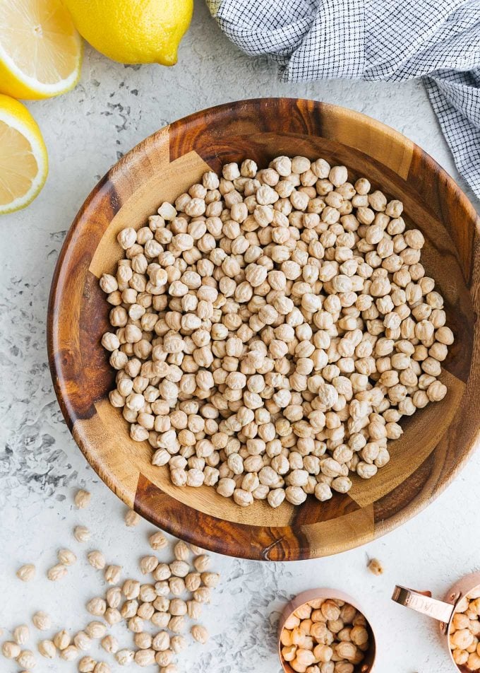 dried chickpeas in a wooden bowl for garbanzo bean salad