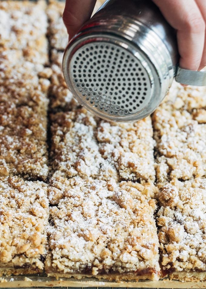 dusting jam bars with powdered sugar