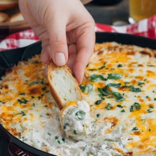 warm crab artichoke dip with crostini dipper