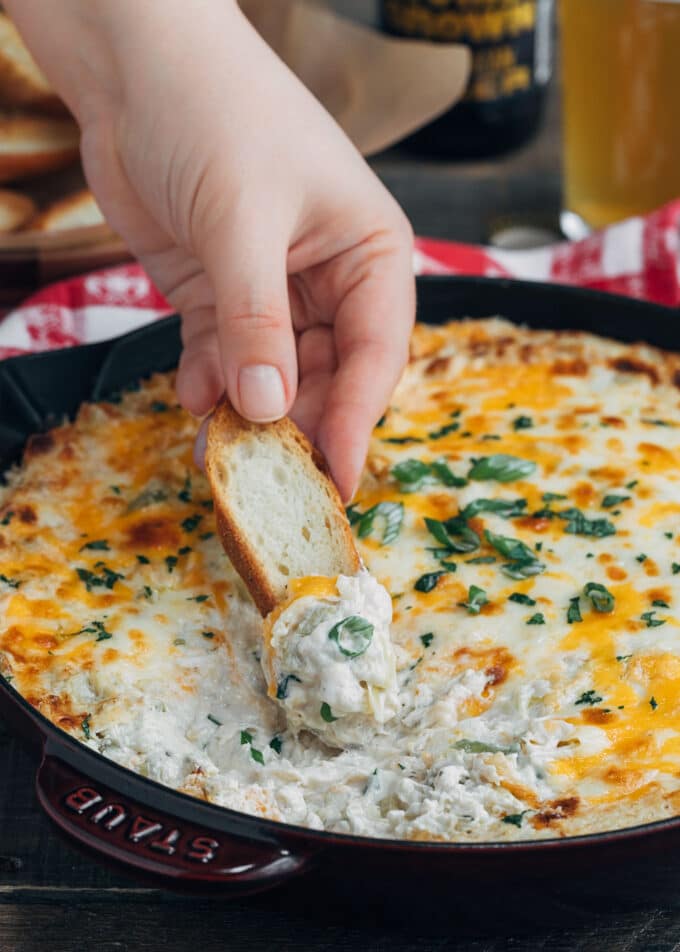 warm crab artichoke dip with crostini dipper