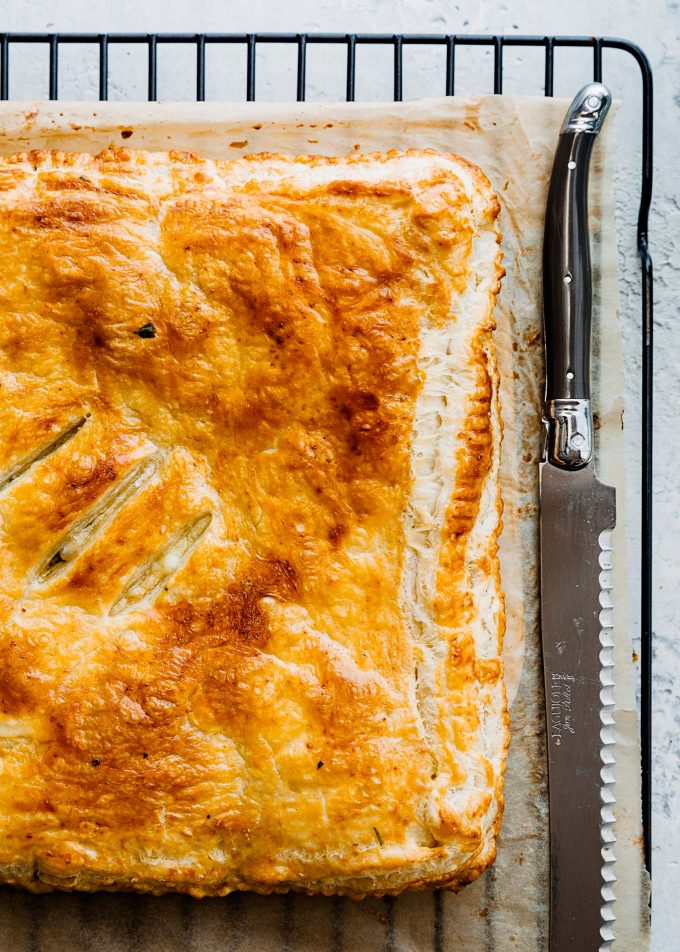 baked ham and cheese slab pie on a cooling rack