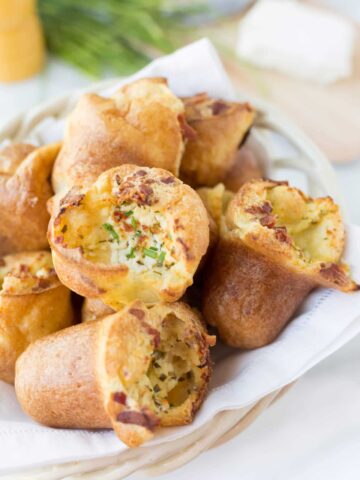 popovers with goat cheese and bacon in a bread basket