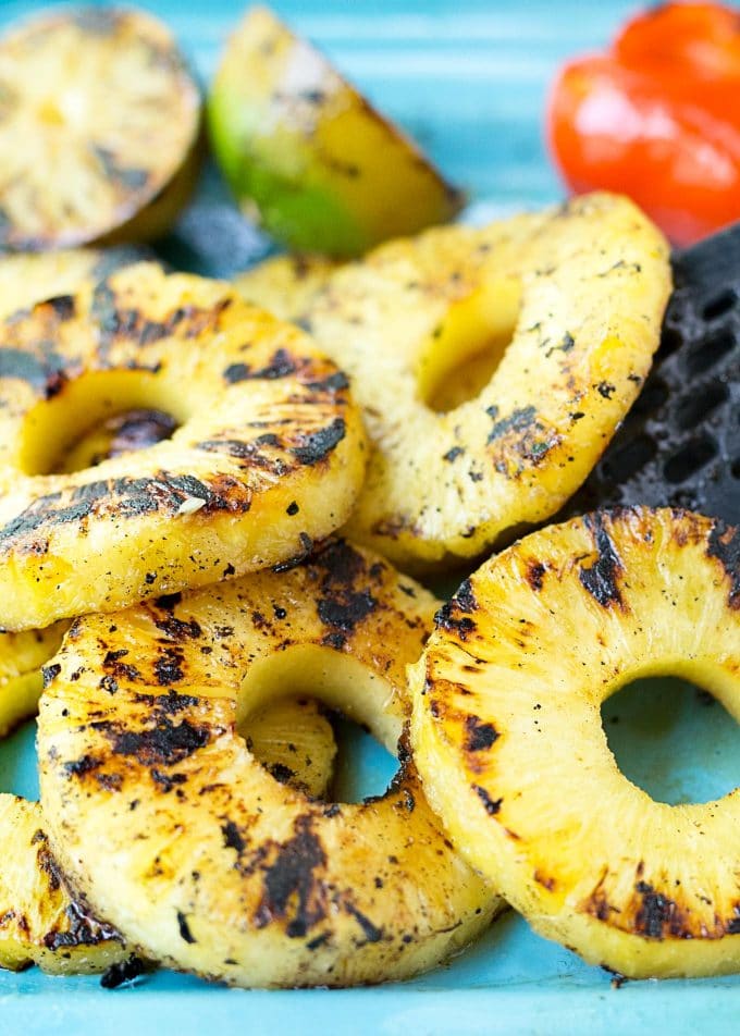 grilled pineapple slices on a platter