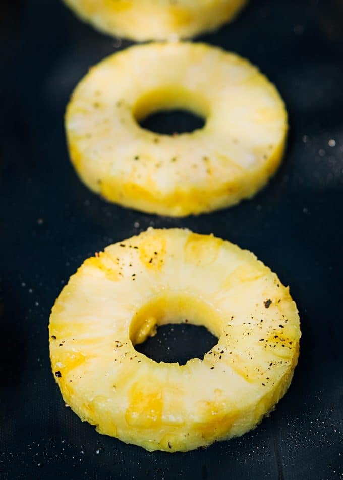 sliced pineapple on a nonstick grill mat