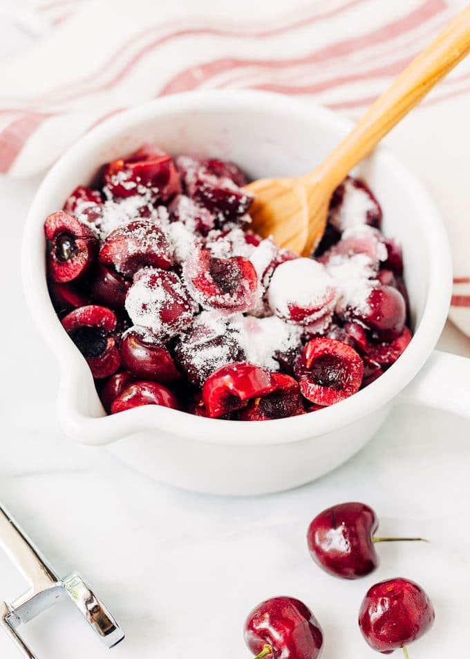 fresh bing cherries in a pot with sugar for ice cream