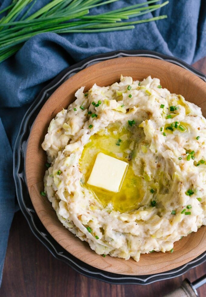 bowl of leek and cabbage colcannon topped with irish butter