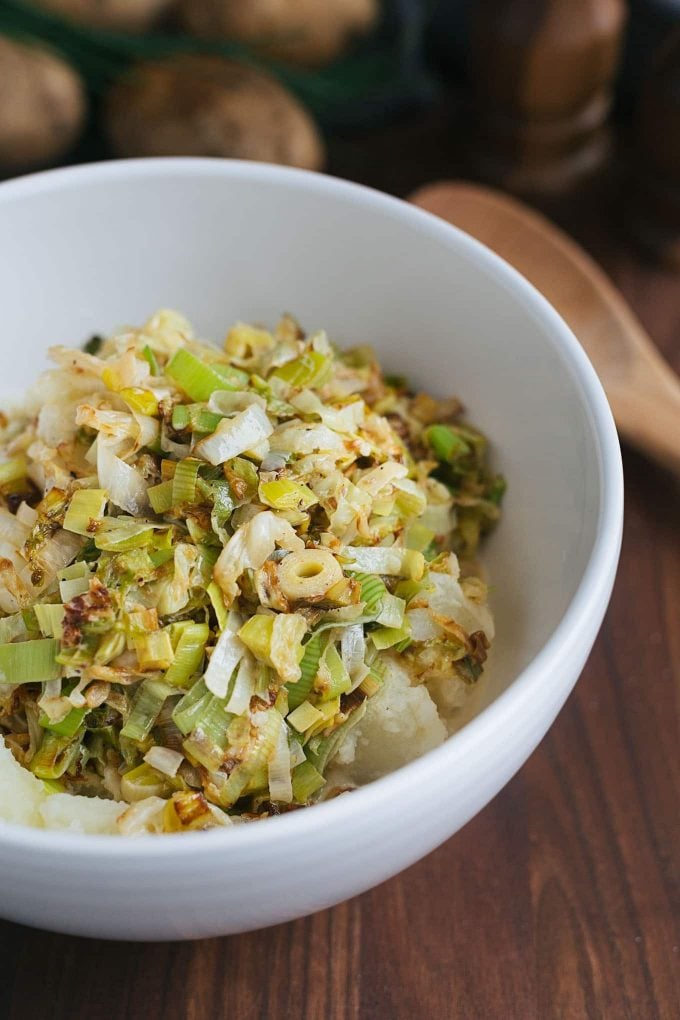 sauteed cabbage and leeks with mashed russet potatoes in a bowl