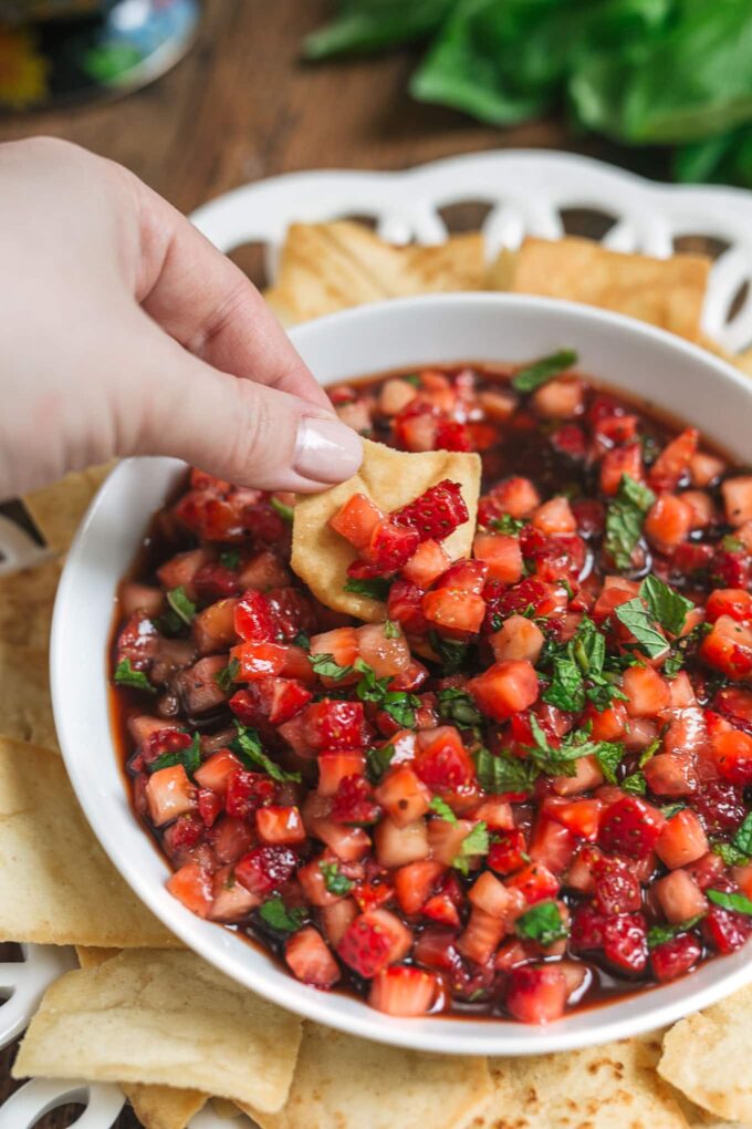 dipping strawberry fruit salsa recipe with a pita chip