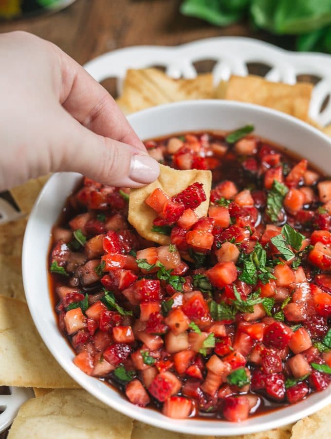 dipping strawberry fruit salsa recipe with a pita chip