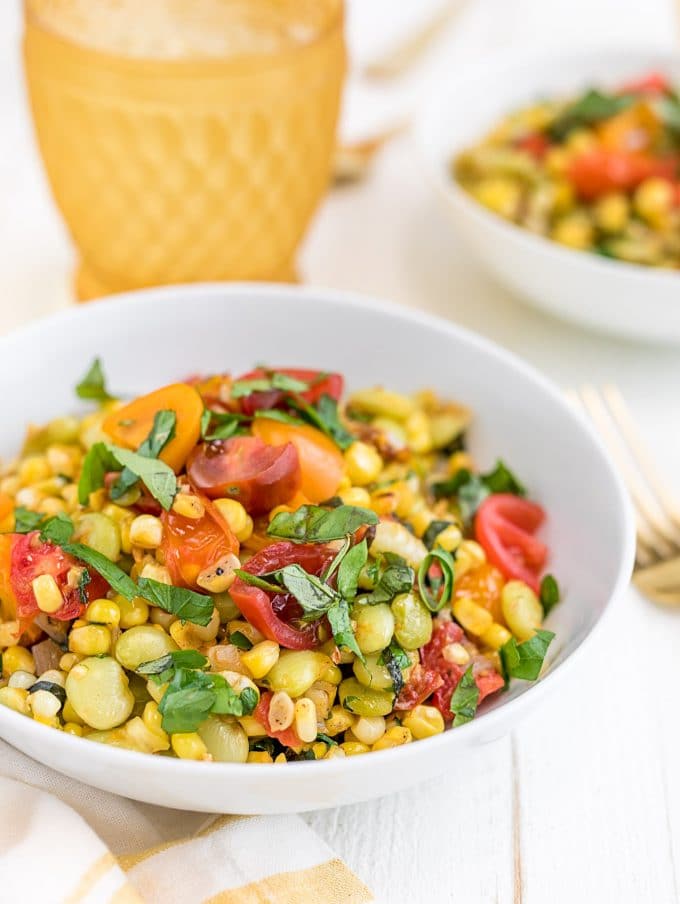 summer corn succotash in a white bowl