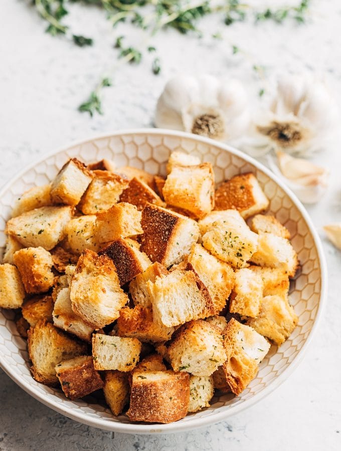 homemade croutons with garlic butter and herbs in a bowl