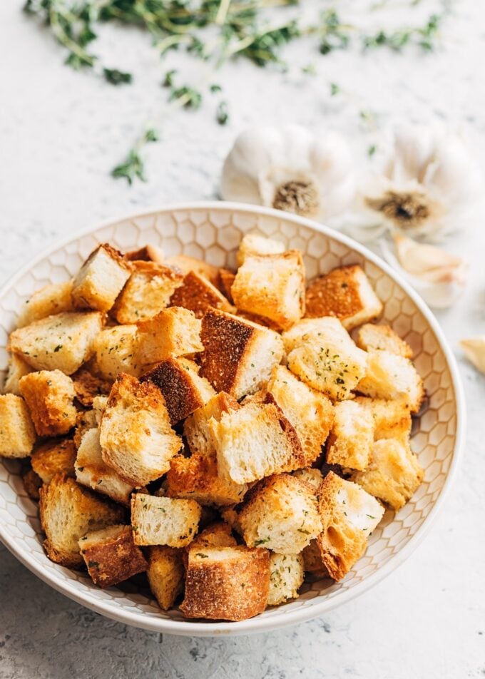 homemade croutons with garlic butter and herbs in a bowl