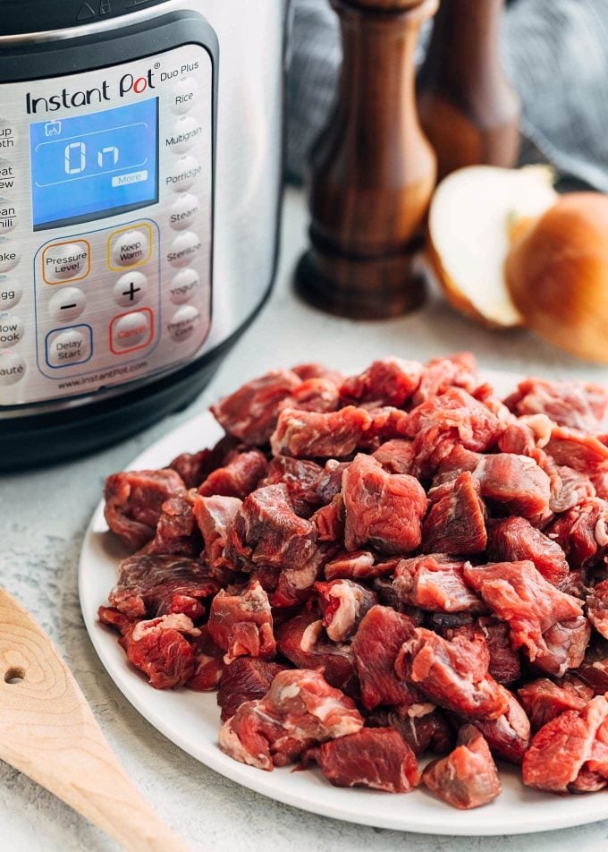 beef chuck cubes in front of the Instant Pot for Texas Red Chili