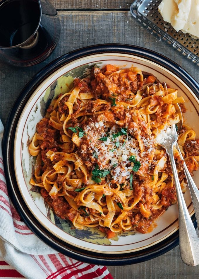 ragu bolognese with tagliatelle pasta and grated parmigano reggiano