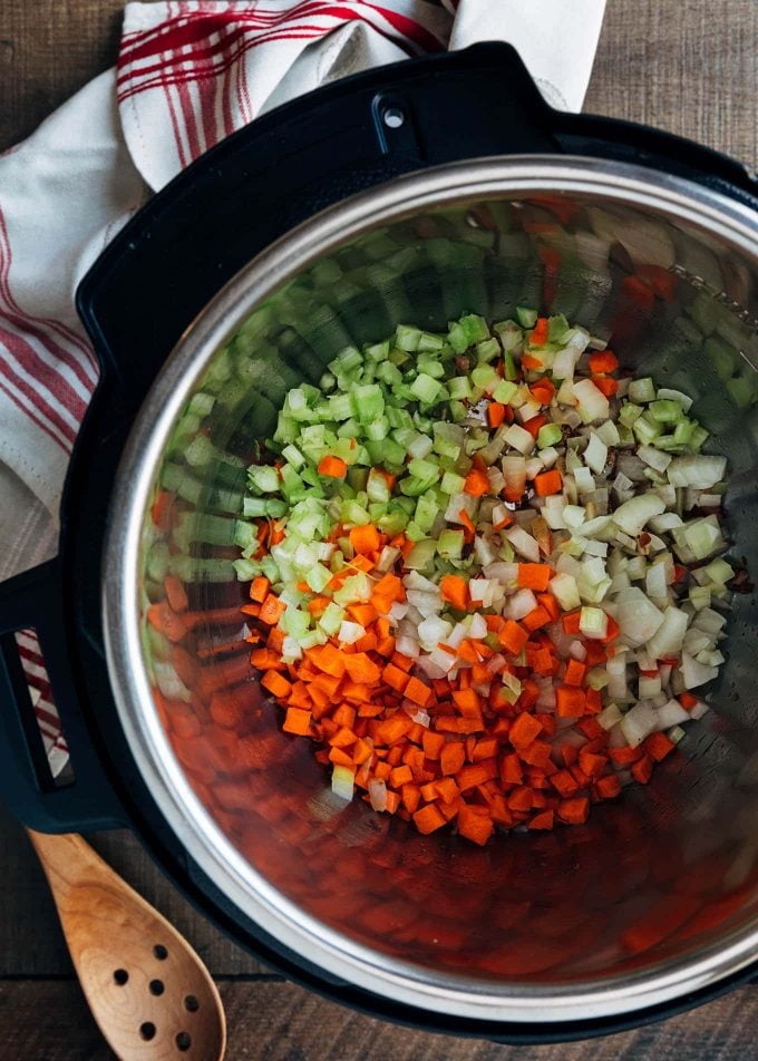 carrots, celery, and onions in an instant pot for bolognese recipe