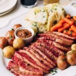 instant pot corned beef served with cabbage, carrots, and potatoes