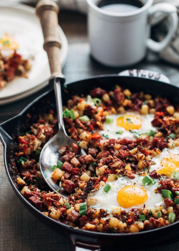 corned beef hash and eggs in a cast iron skillet