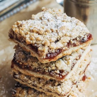 stack of jam bars with oat crumble topping