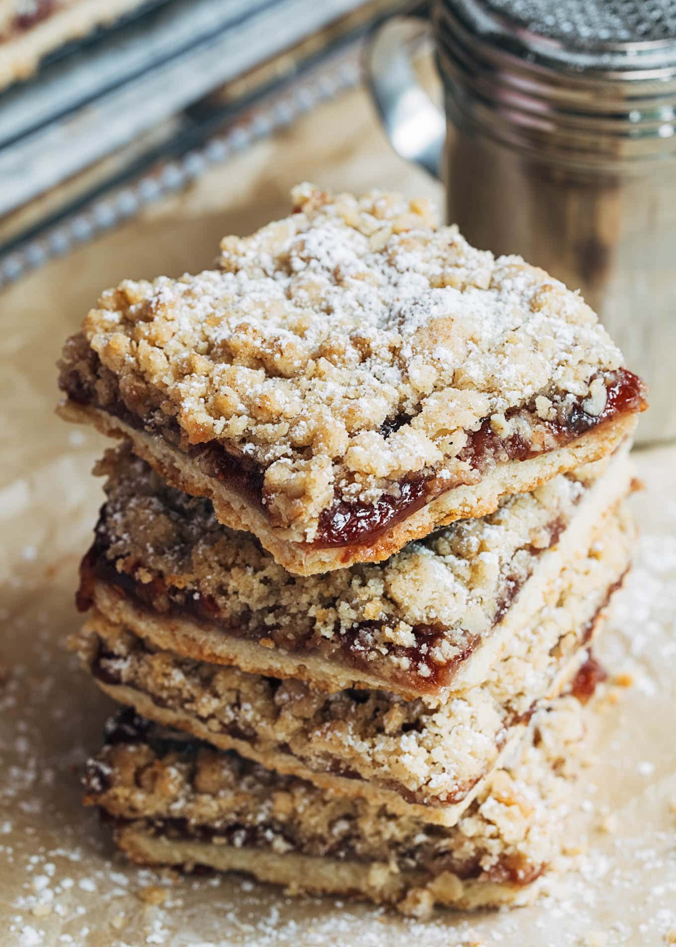 stack of jam bars with oat crumble topping