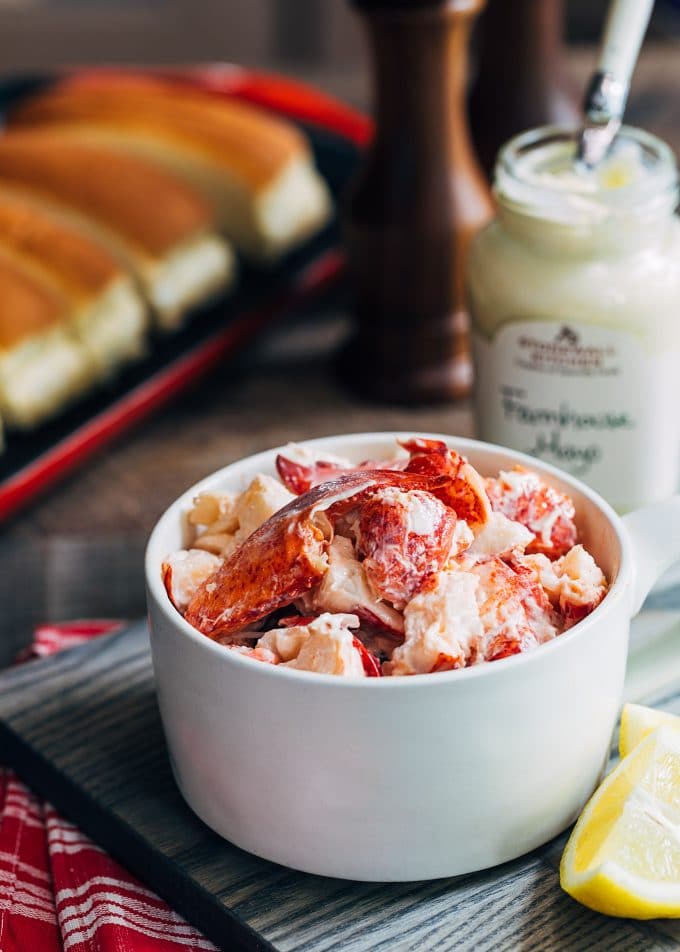 chunks of fresh lobster with mayonnaise in a bowl for lobster rolls