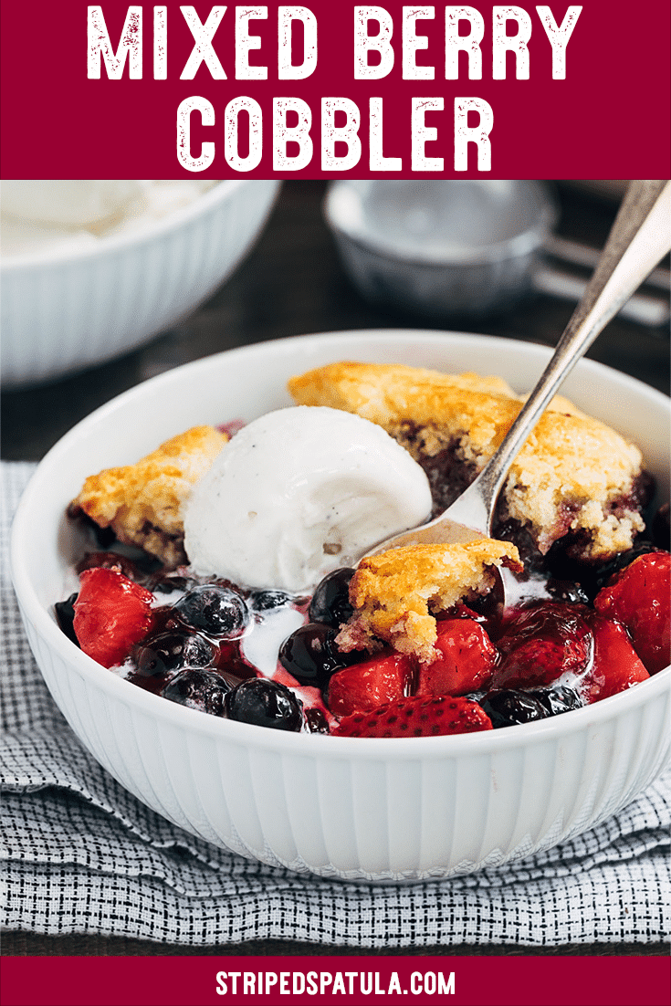 This easy Mixed Berry Cobbler with Cornbread Biscuit Topping is a perfect summer dessert to make with your favorite fresh berries! The light and fluffy cornbread biscuits, brushed with honey butter, are a fun twist on a classic cobbler topping. Serve warm with vanilla ice cream or whipped cream! #berries #cobbler #strawberries #blueberries #dessert