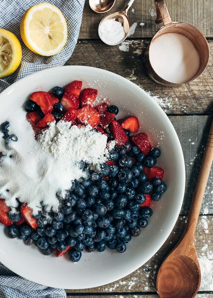 strawberries and blueberries in a bowl for berry cobbler filling