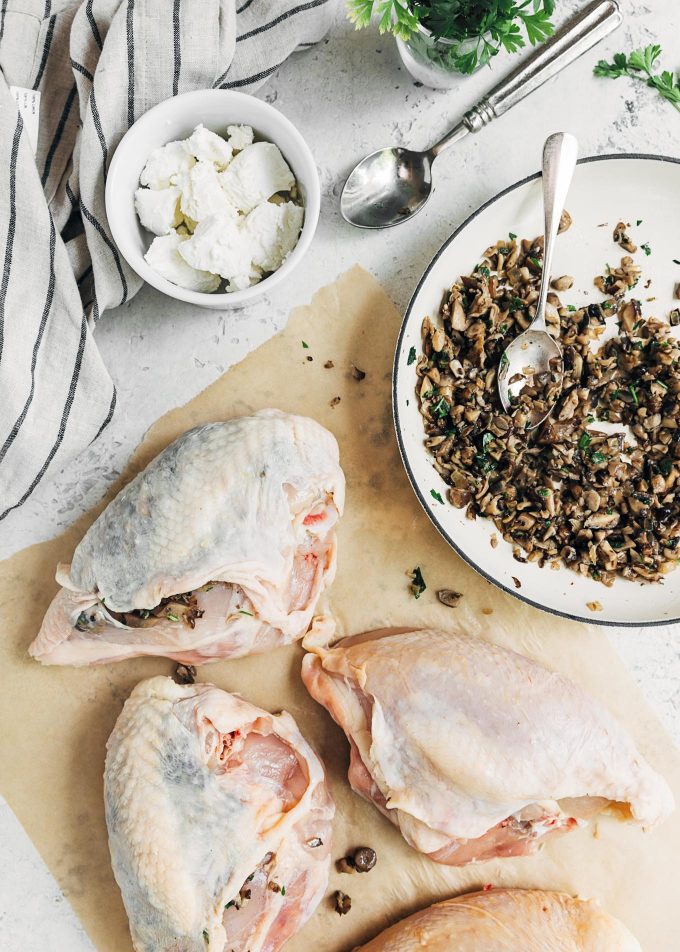 stuffing bone-in chicken breasts with mushrooms and goat cheese