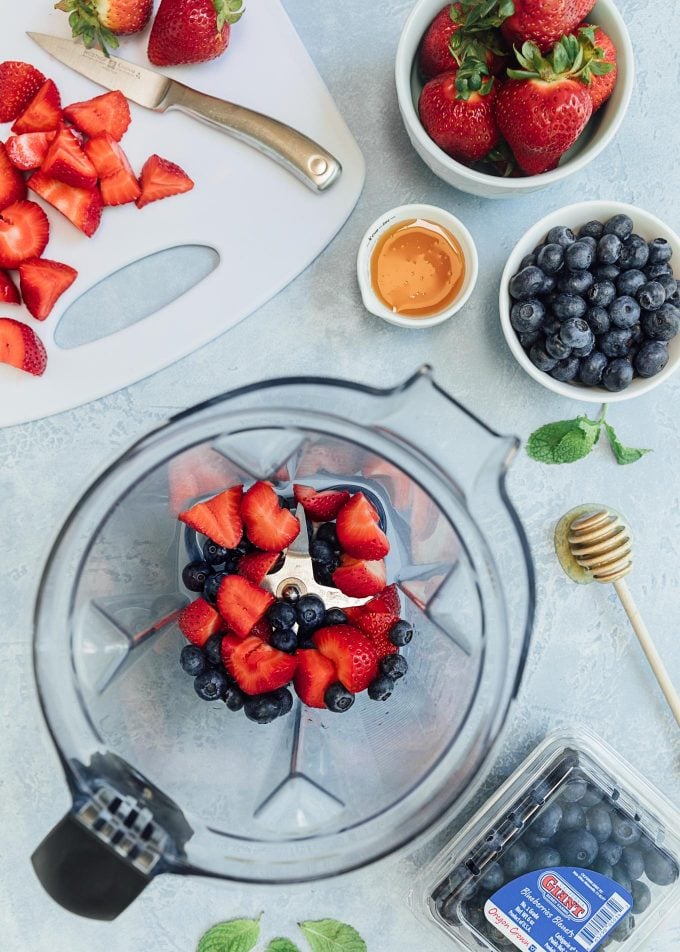 strawberries and blueberries in a blender for mixed berry vinaigrette