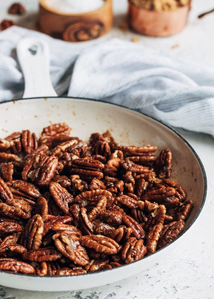 caramelized pecans in a white saute pan