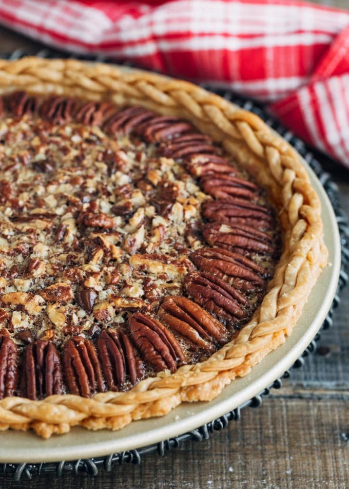 baked chocolate bourbon pecan pie on a cooling rack