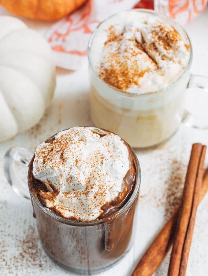 pumpkin hot chocolate in mugs with brown sugar whipped cream