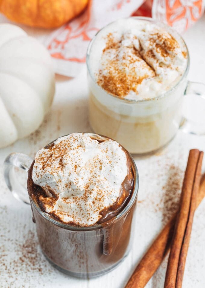 pumpkin hot chocolate in mugs with brown sugar whipped cream