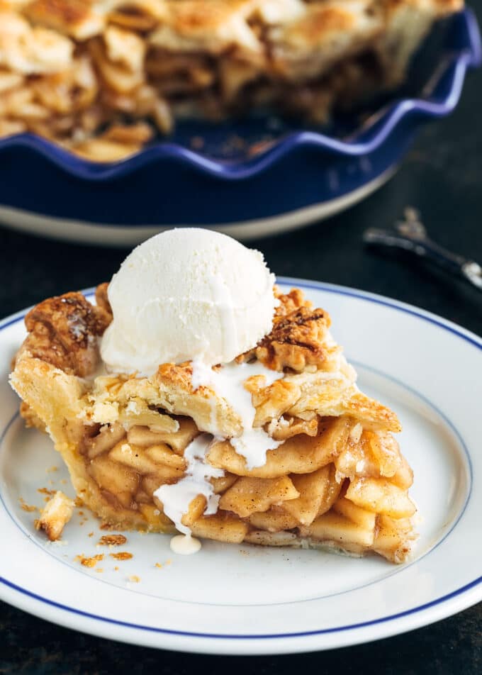 slice of homemade apple pie with a scoop of vanilla ice cream