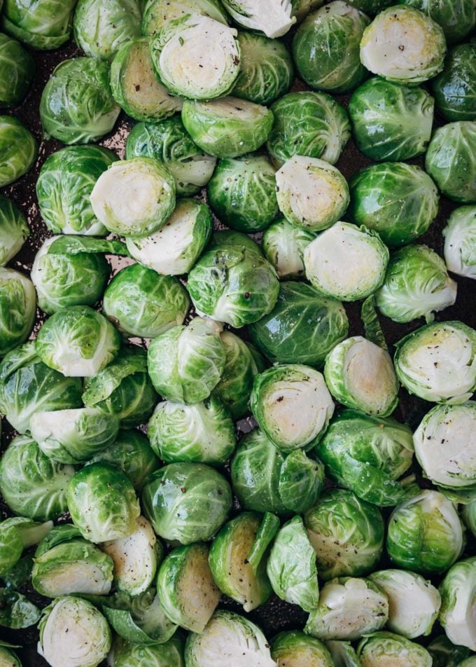 halved brussels sprouts on a pan for roasting