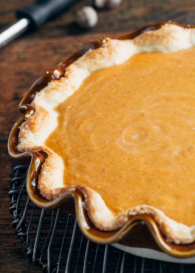 uncooked pumpkin custard pie in a ruffled pie dish