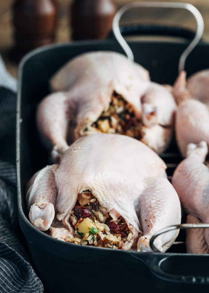 stuffed cornish hens in a baking pan