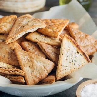 baked homemade pita chips in a serving bowl