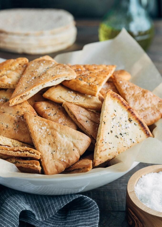 baked homemade pita chips in a serving bowl