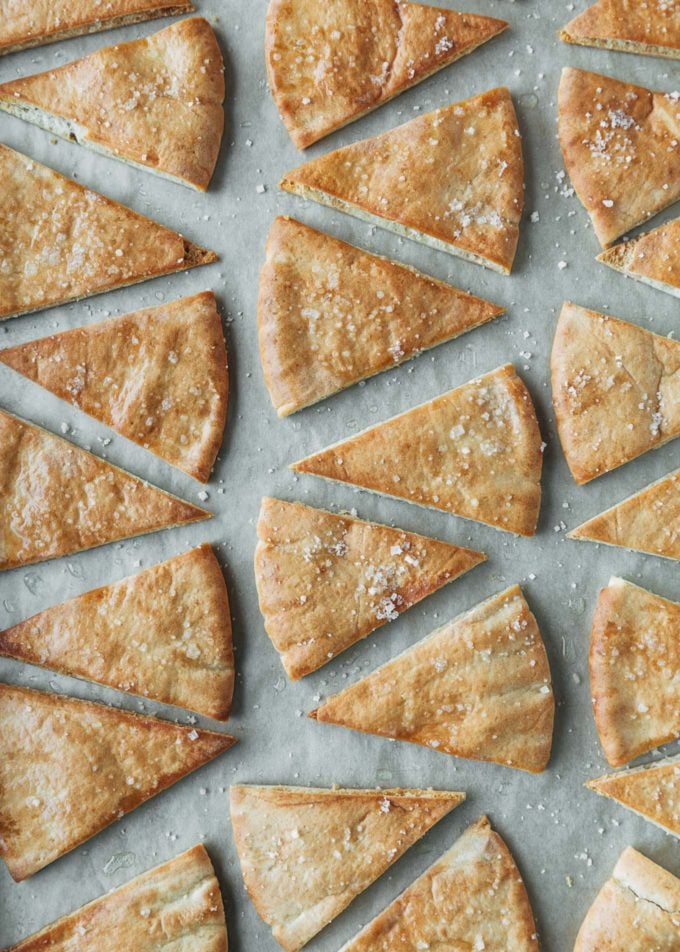 baked pita chips with sea salt on a baking sheet