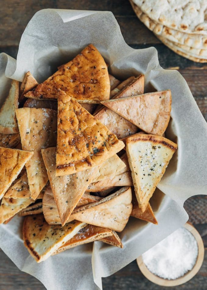 overhead of baked pita chips in a serving bowl