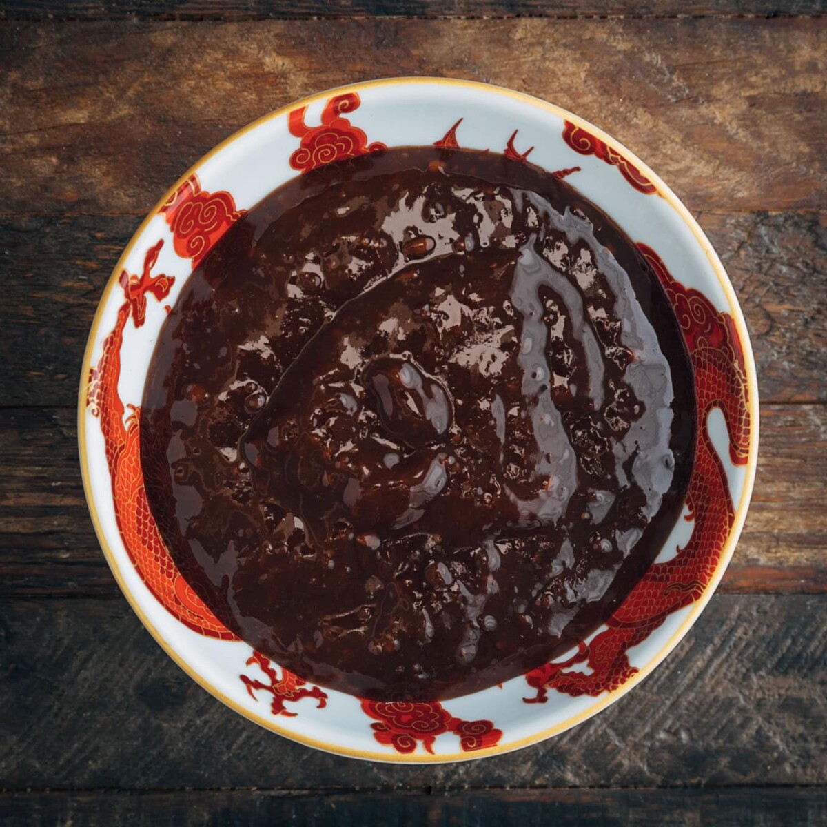 bowl of Asian Hoisin sauce on a wood board