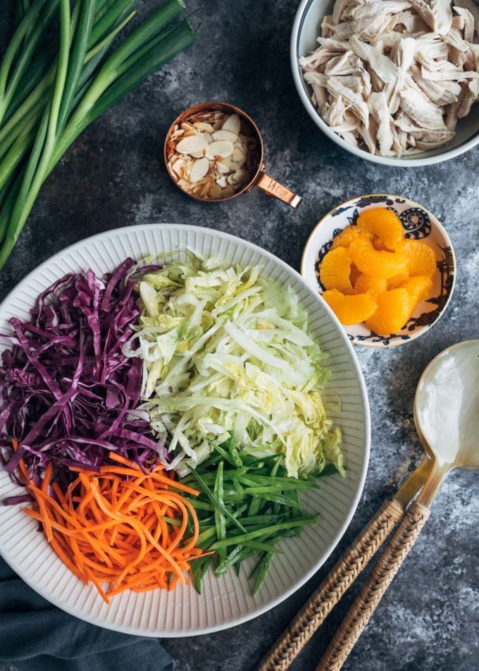 ingredients for mandarin orange chicken salad in bowls