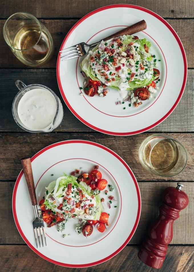 overhead view of plated wedge salads with blue cheese dressing