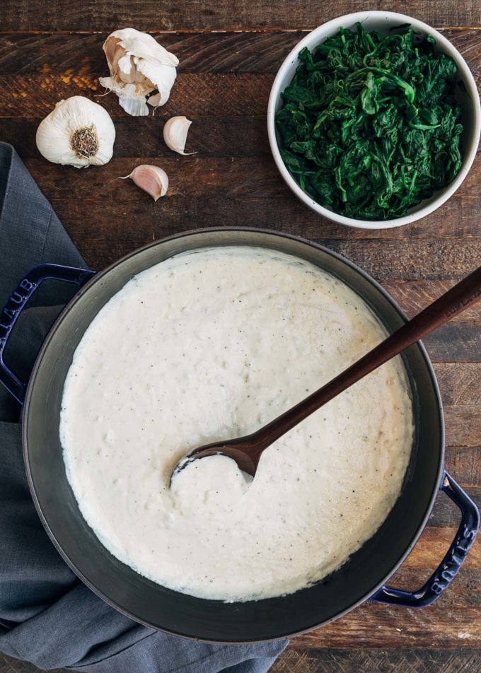 cream sauce for creamed spinach in a pot