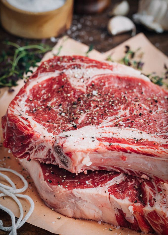 angus ribeye steaks seasoned with sea salt and cracked black pepper