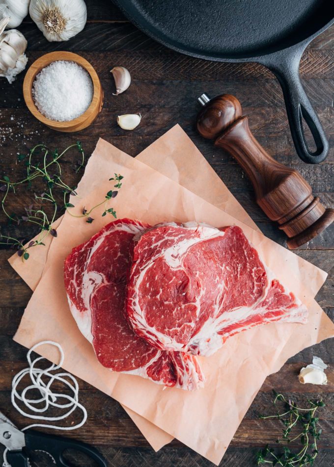 Certified Angus Beef ribeye steaks on butcher paper