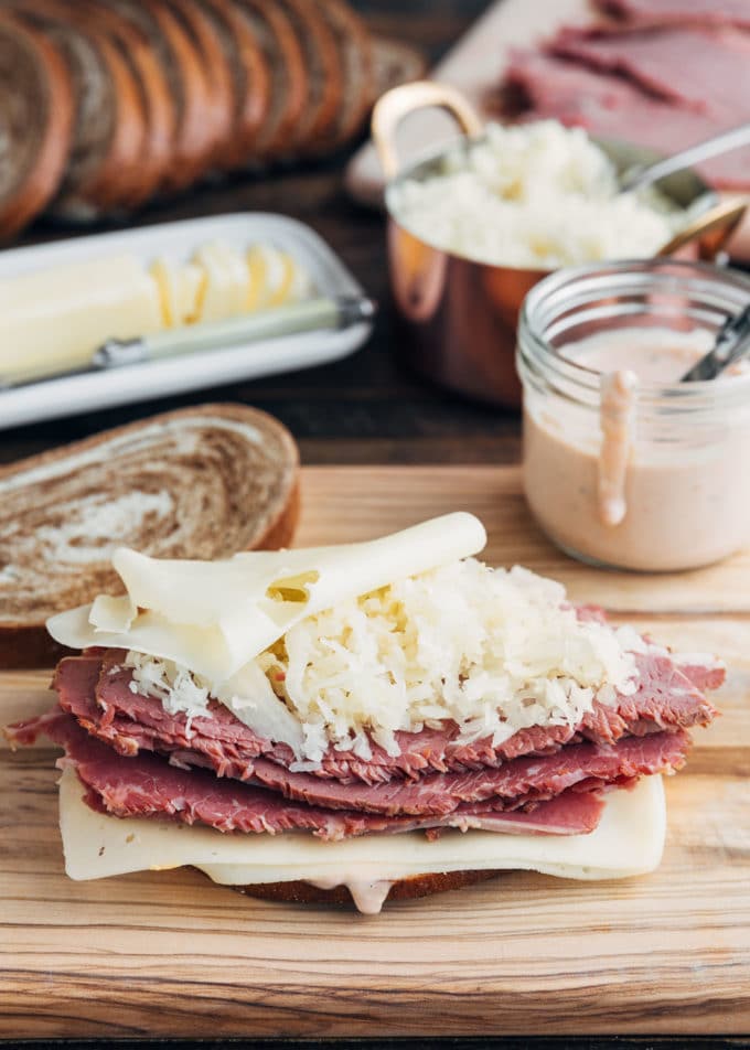 reuben sandwich on a board before grilling