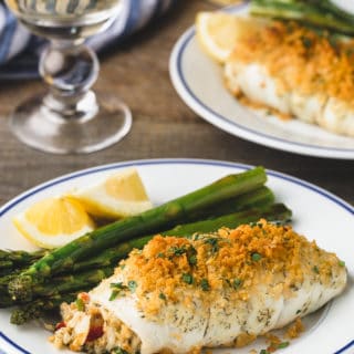 {sponsored} crab stuffed flounder on blue-rimmed white plates with asparagus