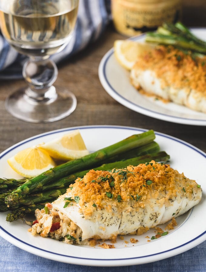 {sponsored} crab stuffed flounder on blue-rimmed white plates with asparagus